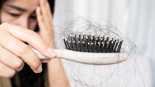 pulling hair out of a brush