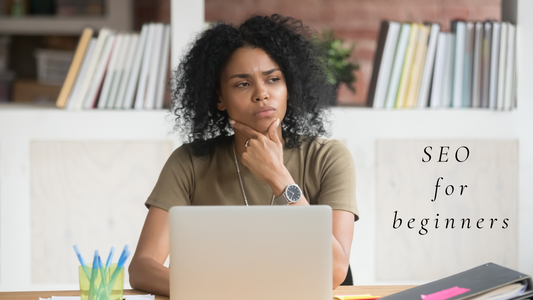 Woman looking puzzled sitting behind a laptop